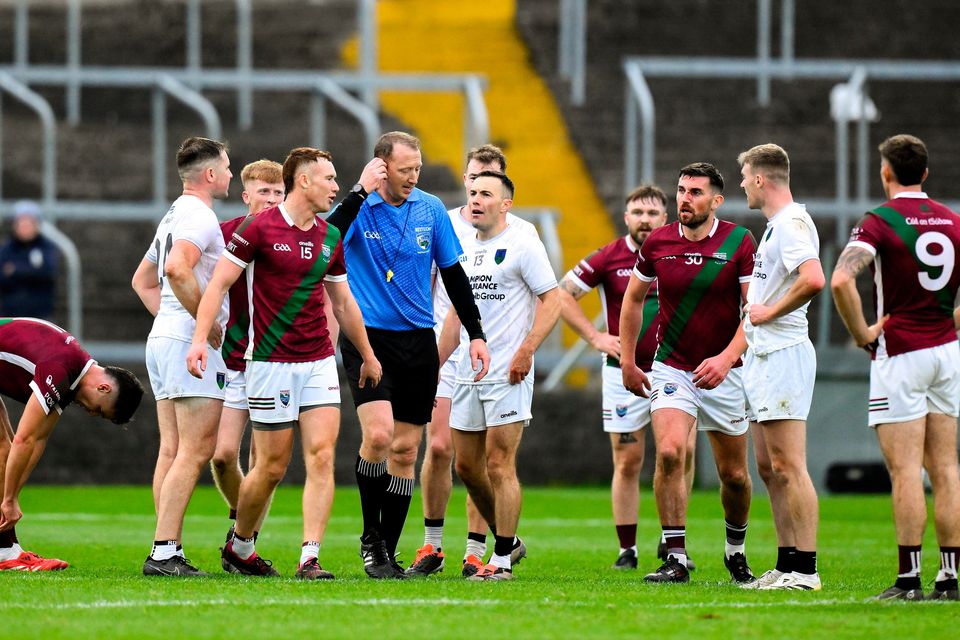 Players question referee Séamus Mulhare at the final whistle of the Laois SFC final between Courtwood and Portarlington at Laois Hire O'Moore Park. Photo: Brendan Moran/Sportsfile