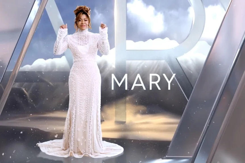 Mary Cosby wearing a white dress in front of a mountain and cloud graphic