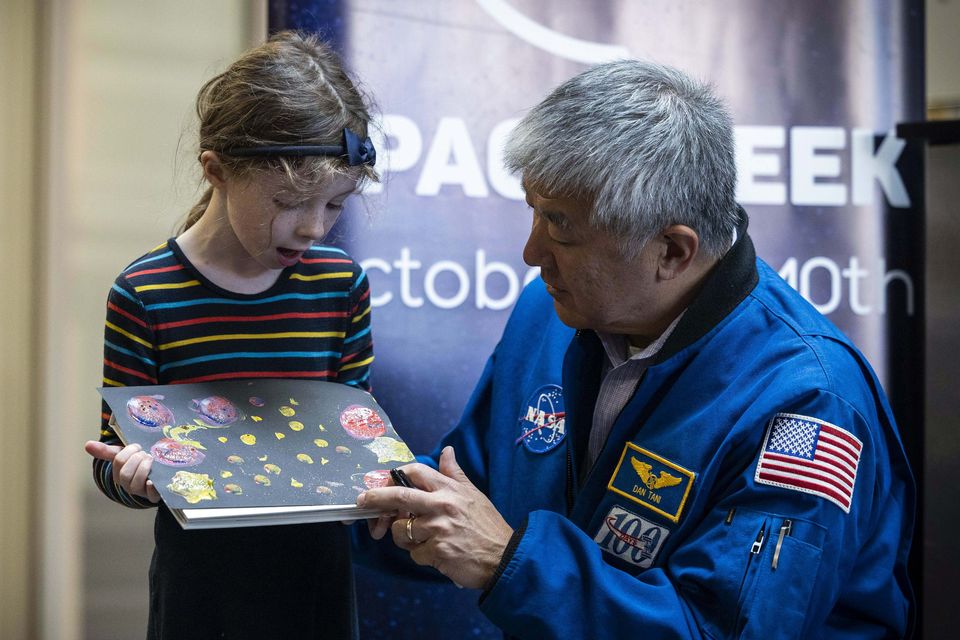 Pictured:Former NASA astronaut Dan Tani  delighting in Fiadh Newman of Inishshannon's Space art work and knowlege of the Cosmos   pictured at the first public event of Space Week Ireland 2025 which took place at the Cork School of Music