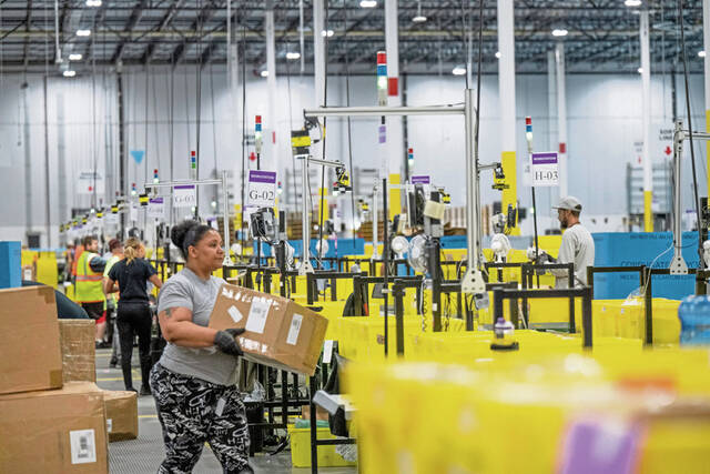 8911368_web1_gtr-WarehouseWorkers102-101525