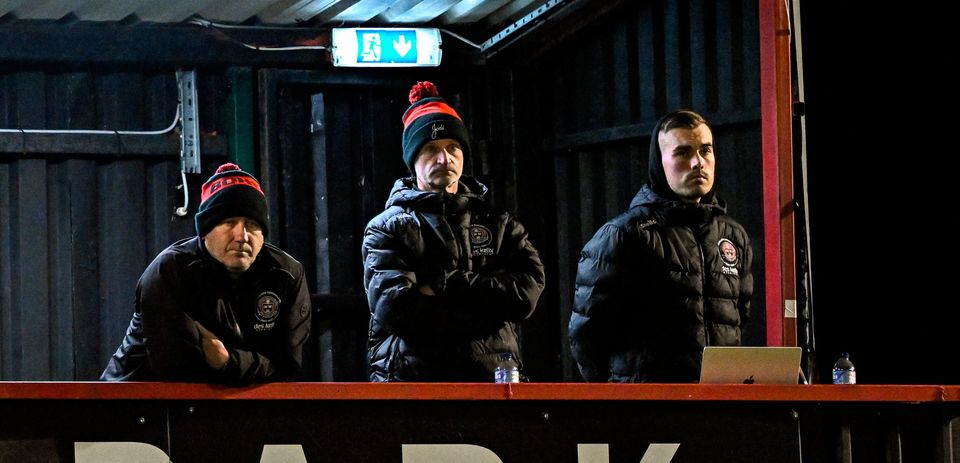 Bohemians manager Alan Reynolds, left, who received a red card at half-time watches on with analysts Alan Moore and Aaron Fitzsimons, right. Photo: Sam Barnes/Sportsfile