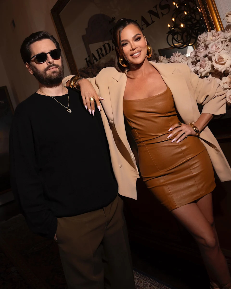 Scott Disick and Khloé Kardashian pose together for a portrait