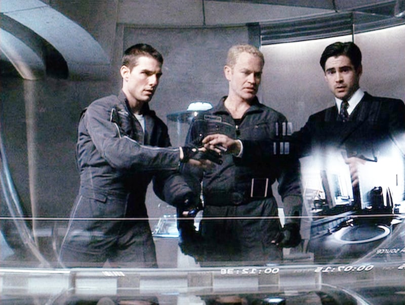 Tom Cruise (as Chief John Anderton), Neal McDonough (as Officer Fletcher) and Colin Farrell (as Danny Witwer) in “Minority Report.”