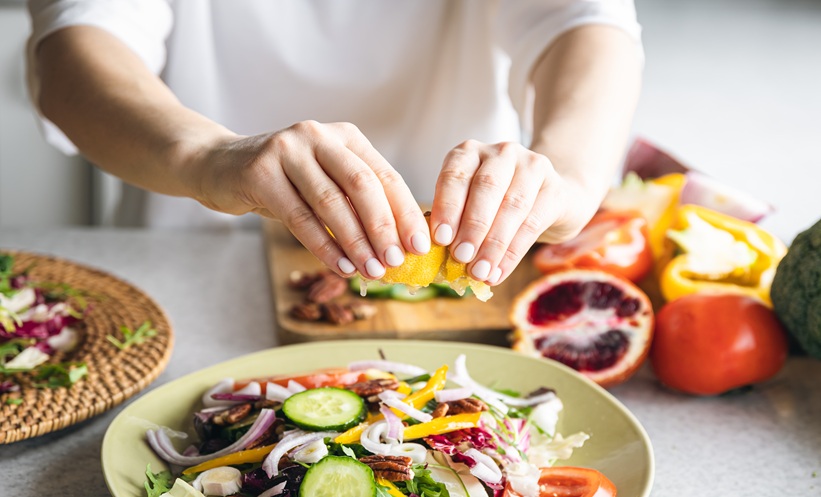cancer survivor eating healthy meal while seated indoors