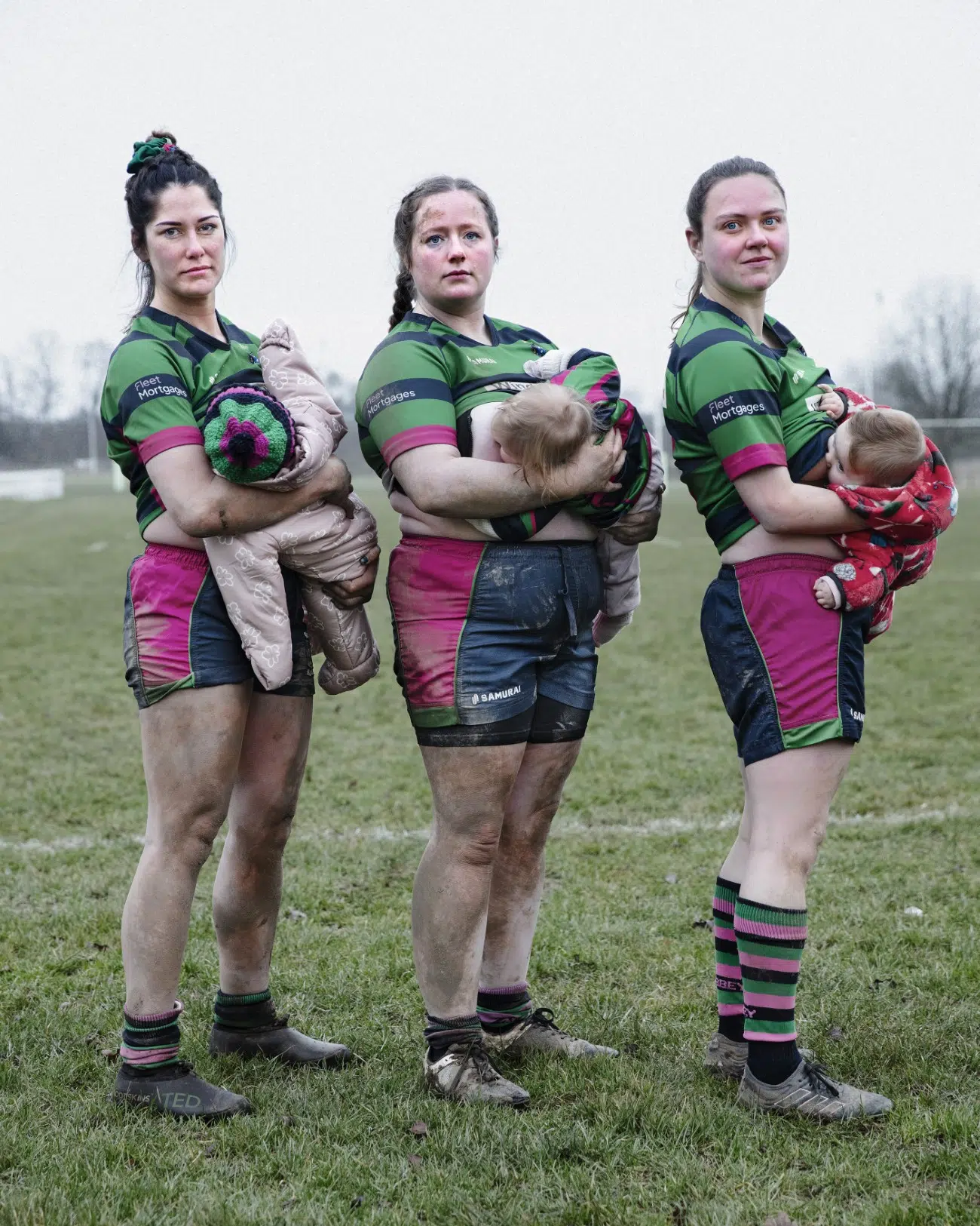 Three young mothers in their rugby kit