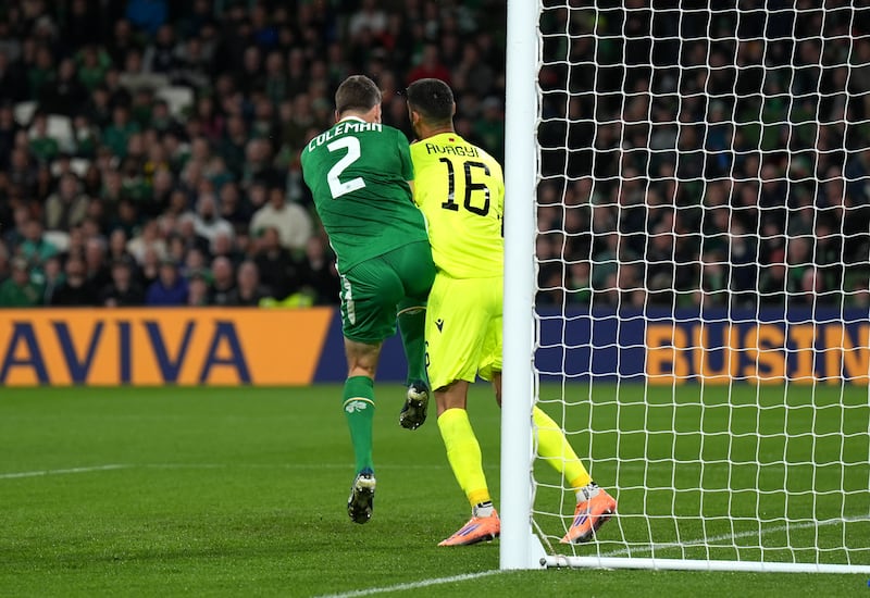 Séamus Coleman collides with Armenia goalkeeper Henri Avagyan at the Aviva Stadium. Photograph: Niall Carson/PA Wire