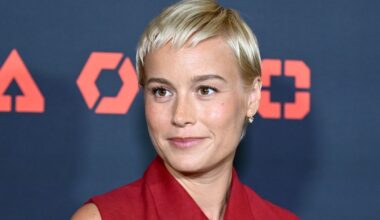 Brie Larson Pairs Platinum Mullet With Quirky Skirt Full of Trinkets