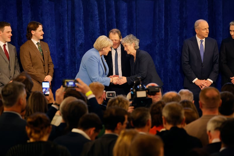  Catherine Connolly and her husband Brian McEnry embrace fellow candidate Heather Humphreys on stage at Dublin Castle. Photograph: Alan Betson
