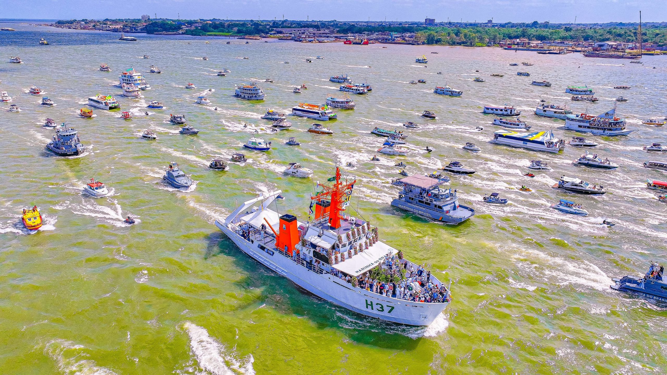 Procession of boats on river