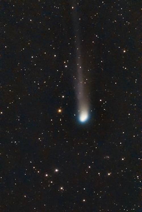 Round, fuzzy glowing ball in a starfield and it has a long tail.