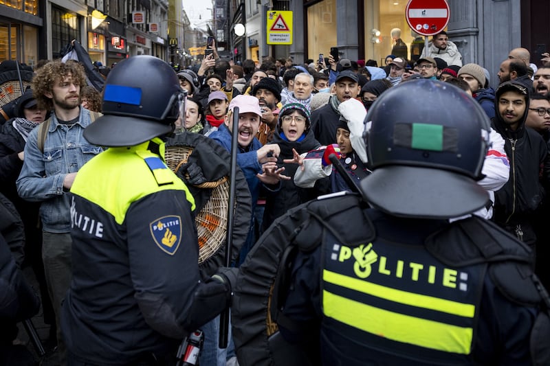 Police officers clear people away from Dam Square during a pro-Palestinian protest in Amsterdam. Photograph: Robin van Lonkhuijsen/ANP/AFP/Getty Images