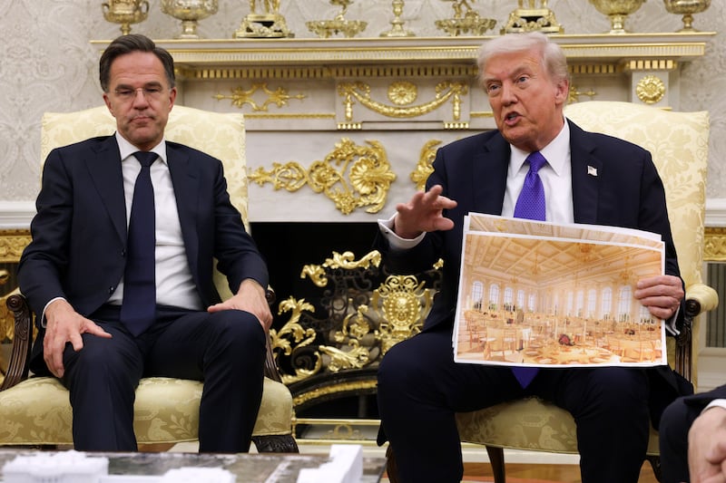 President Donald Trump displays a rendering of his proposed $250 million White House ballroom as he meets Nato secretary general Mark Rutte (L) in the Oval Office of the White House on October 22nd, 2025. Photograph: Alex Wong/Getty Images
