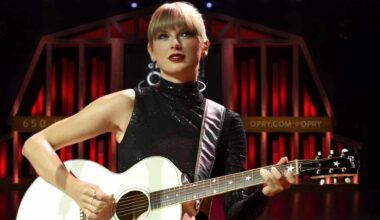 Former country star Taylor Swift performs with an acoustic guitar, marking her milestone as the first woman to sell over 100 million albums.