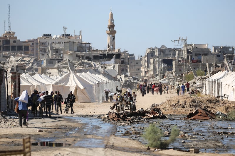Displaced Palestinians return to their homes. Photograph: Eyad Baba/AFP via Getty Images        