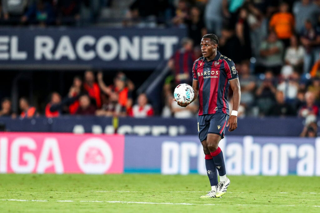 Karl Etta Eyong holding the ball while in action for Levante.