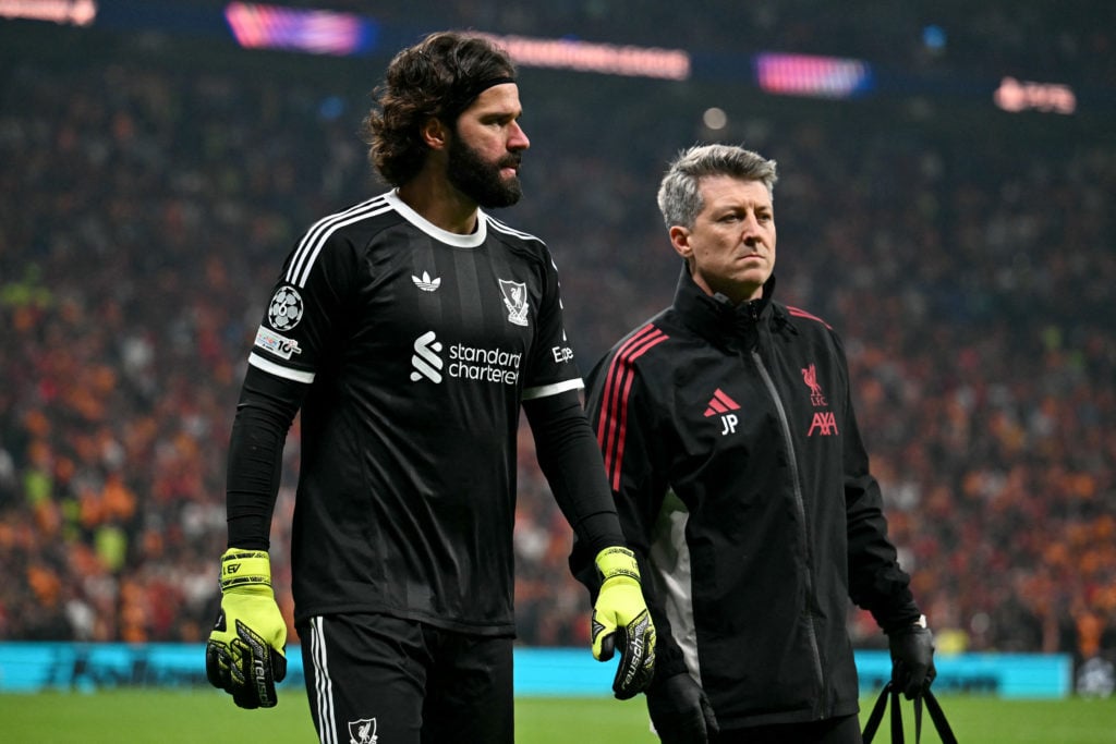 Alisson Becker walks off injured during Liverpool's UEFA Champions League match against Galatasaray at Rams Park.