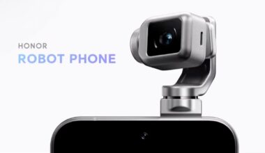 A close-up of a smartphone with a robotic camera module attached on top. The words "Honor Robot Phone" appear on the left side of the image. The background is plain and light-colored.