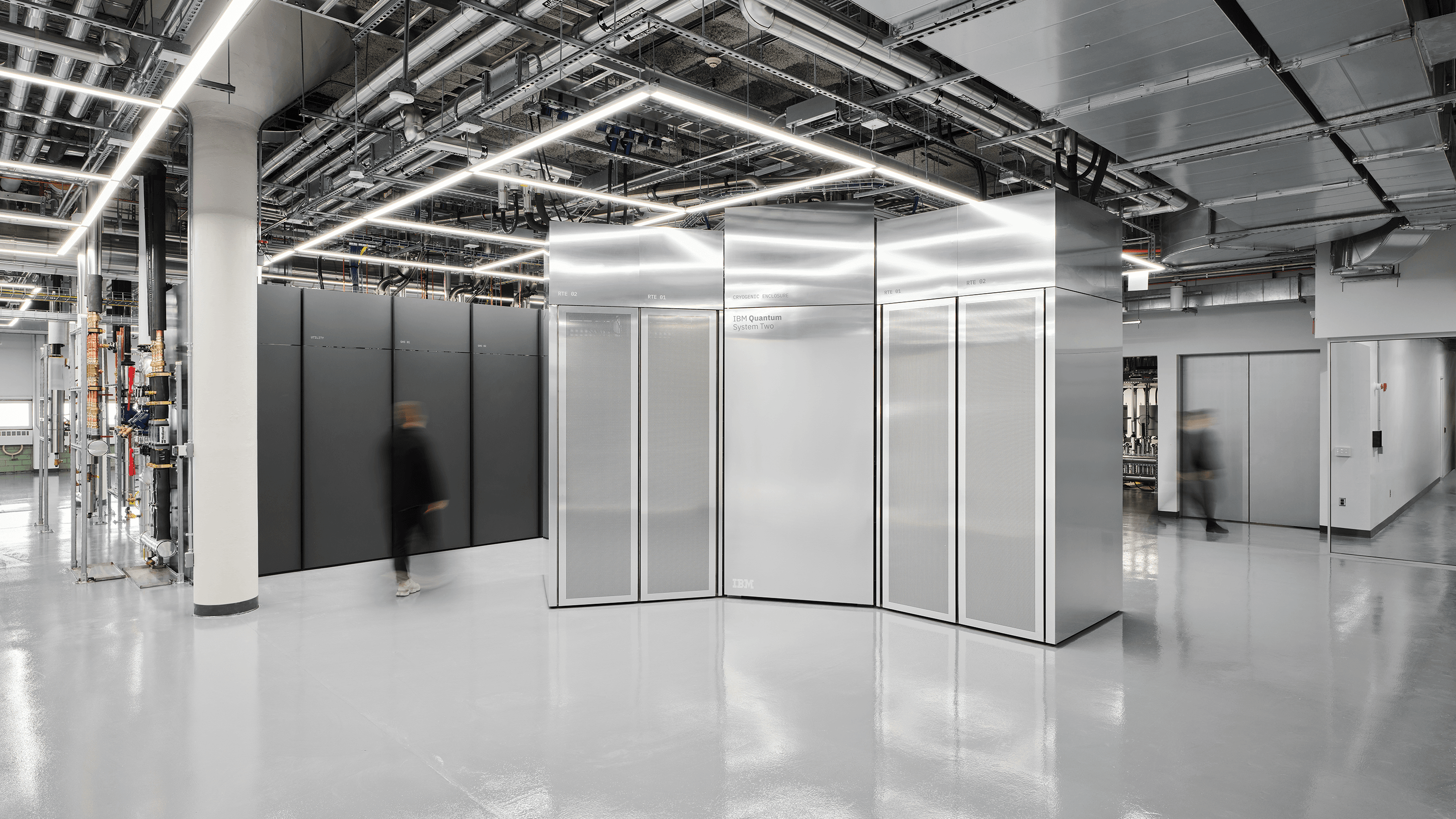 Photograph of IBM Quantum System Two in the Poughkeepsie data center, 2025. IBM Quantum-POK-02-People-2_16-9.png