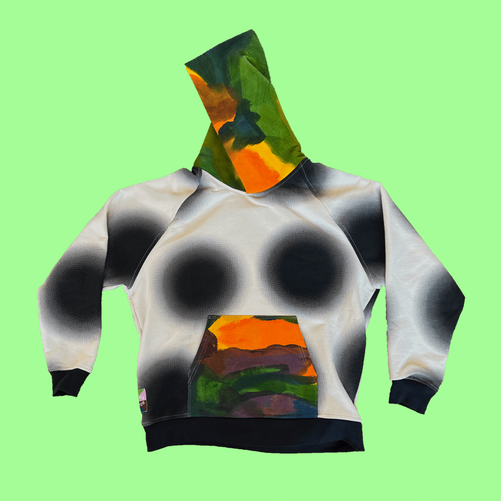 A TCG sunspot hoodie with hand-painted hood and pocket.