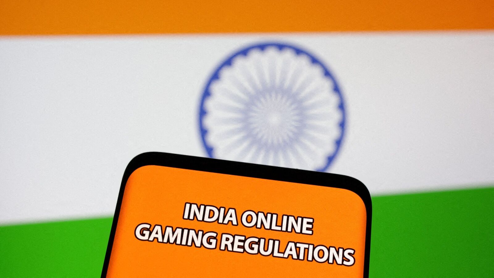 FILE PHOTO: The words 'India online gaming regulations' are displayed in front of an Indian flag in this Illustration taken September 14, 2022.