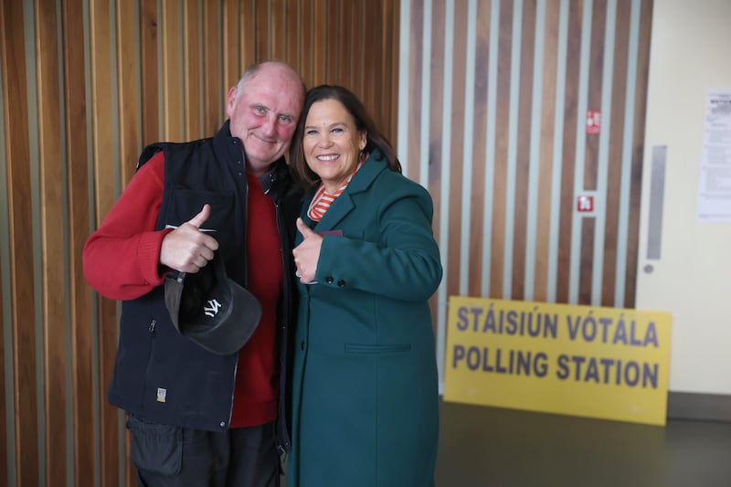 Sinn Féin leader Mary Lou McDonald poses with James Downey as she arrives at the Deaf Village in Cabra, north Dublin, to cast her vote. Photograph: Liam McBurney/PA Wire
