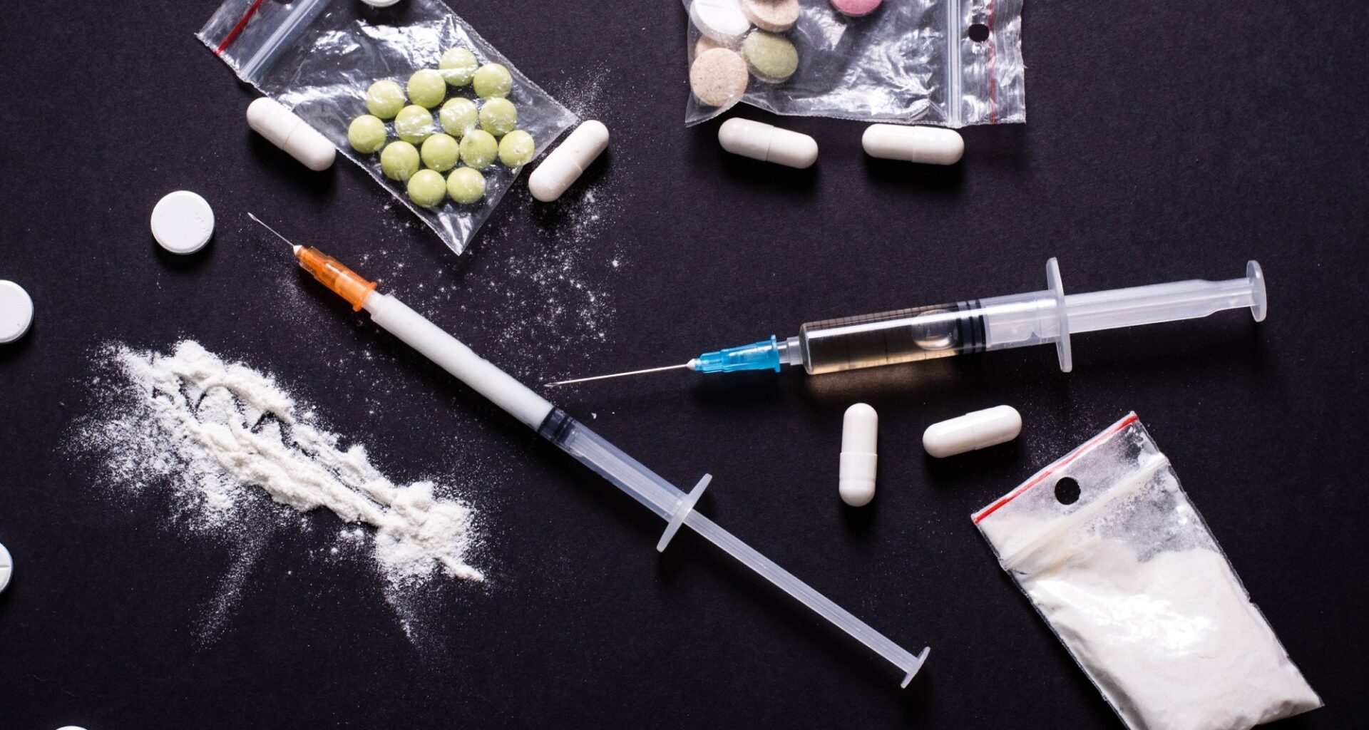 Hard drugs on dark table