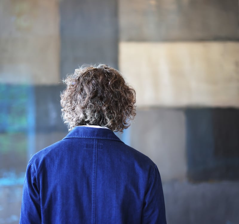 Bryan Meehan standing at one of his Sean Scully paintings, 'Moorland' 2007 which hangs in the hotel's dining room. Photos: Bryan O’Brien / The Irish Times 
