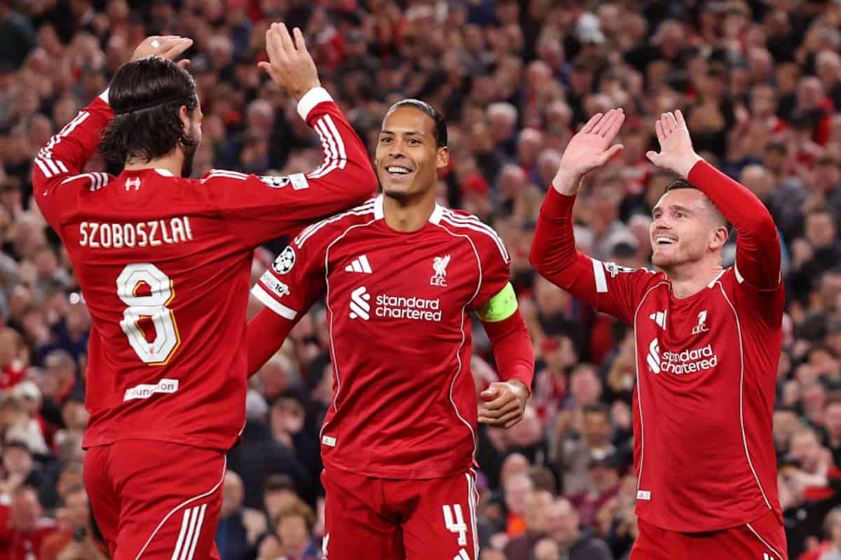 LIVERPOOL, ENGLAND - SEPTEMBER 17: Andrew Robertson of Liverpool celebrates scoring his team's first goal with Dominik Szoboszlai and Virgil van Dijk during the UEFA Champions League 2025/26 League Phase MD1 match between Liverpool FC and Atletico de Madrid at Anfield on September 17, 2025 in Liverpool, England. (Photo by Michael Regan - UEFA/UEFA via Getty Images)