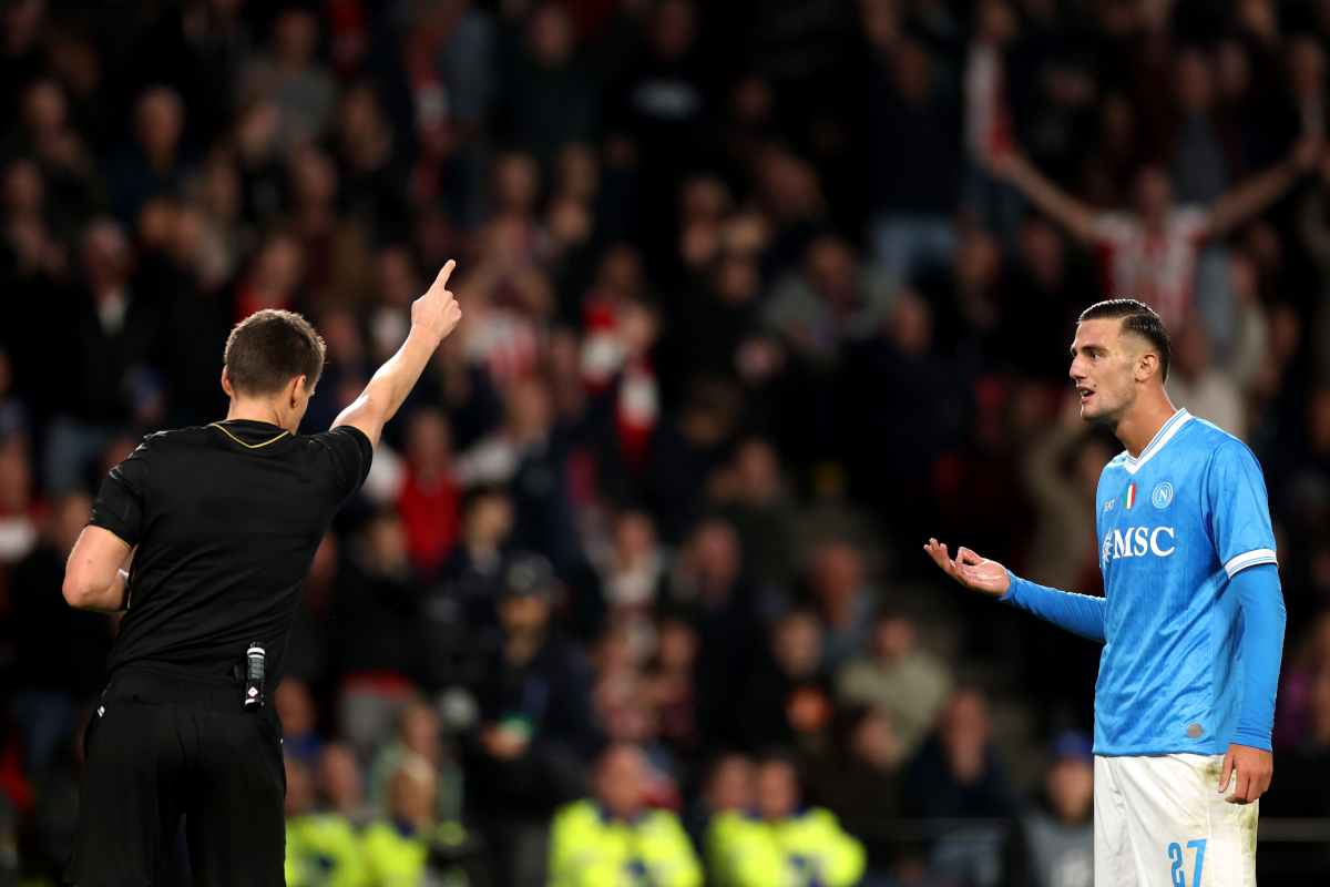 EINDHOVEN, NETHERLANDS - OCTOBER 21: Lorenzo Lucca of Napoli reacts after being shown a red card by referee, Daniel Siebert, during the UEFA Champions League 2025/26 League Phase MD3 match between PSV Eindhoven and SSC Napoli at PSV Stadion on October 21, 2025 in Eindhoven, Netherlands. (Photo by Dean Mouhtaropoulos/Getty Images)