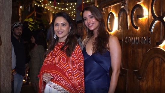 Madhuri Dixit and Triptii Dimri posed outside a restaurant in Mumbai.