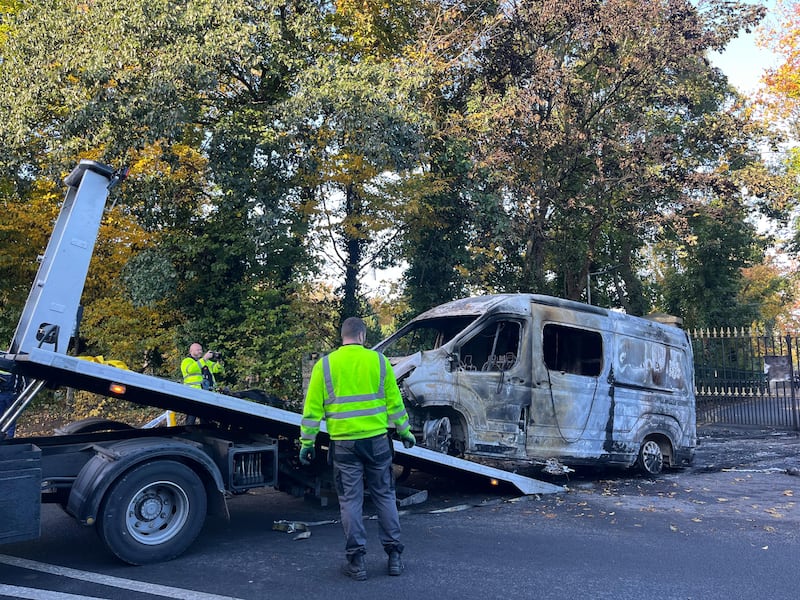 A van set on fire by protesters at Citywest hotel on Tuesday night is removed from the scene on Wednesday morning. Photograph: Sarah Burns