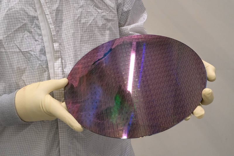 Intel 18A Panther Lake wafer is the centrepiece of the company's comeback hopes. Photograph: Loren Elliott/The New York Times
                      
