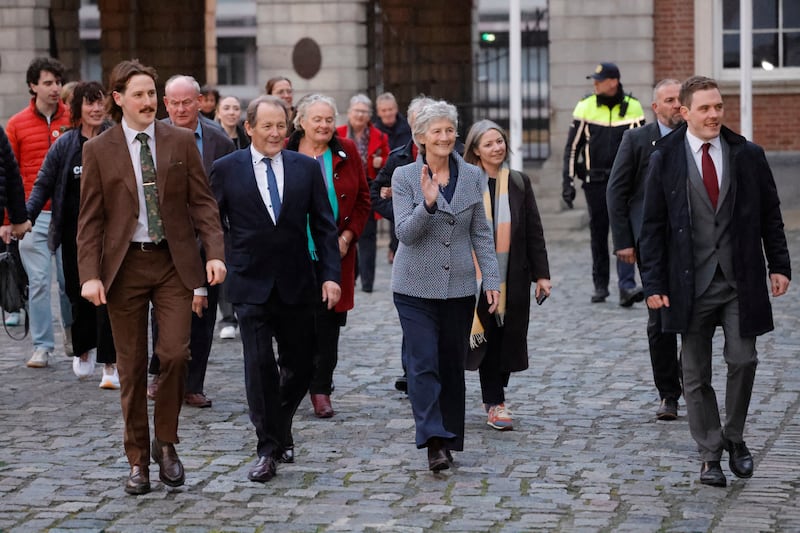 President-elect Catherine Connolly arrives at Dublin Castle accompanied by her family, her husband Brian McEnery and her sons Brian and Stephen and (right), and her campaign manager Béibhinn O’Connor (wearing scarf). Photograph: Alan Betson