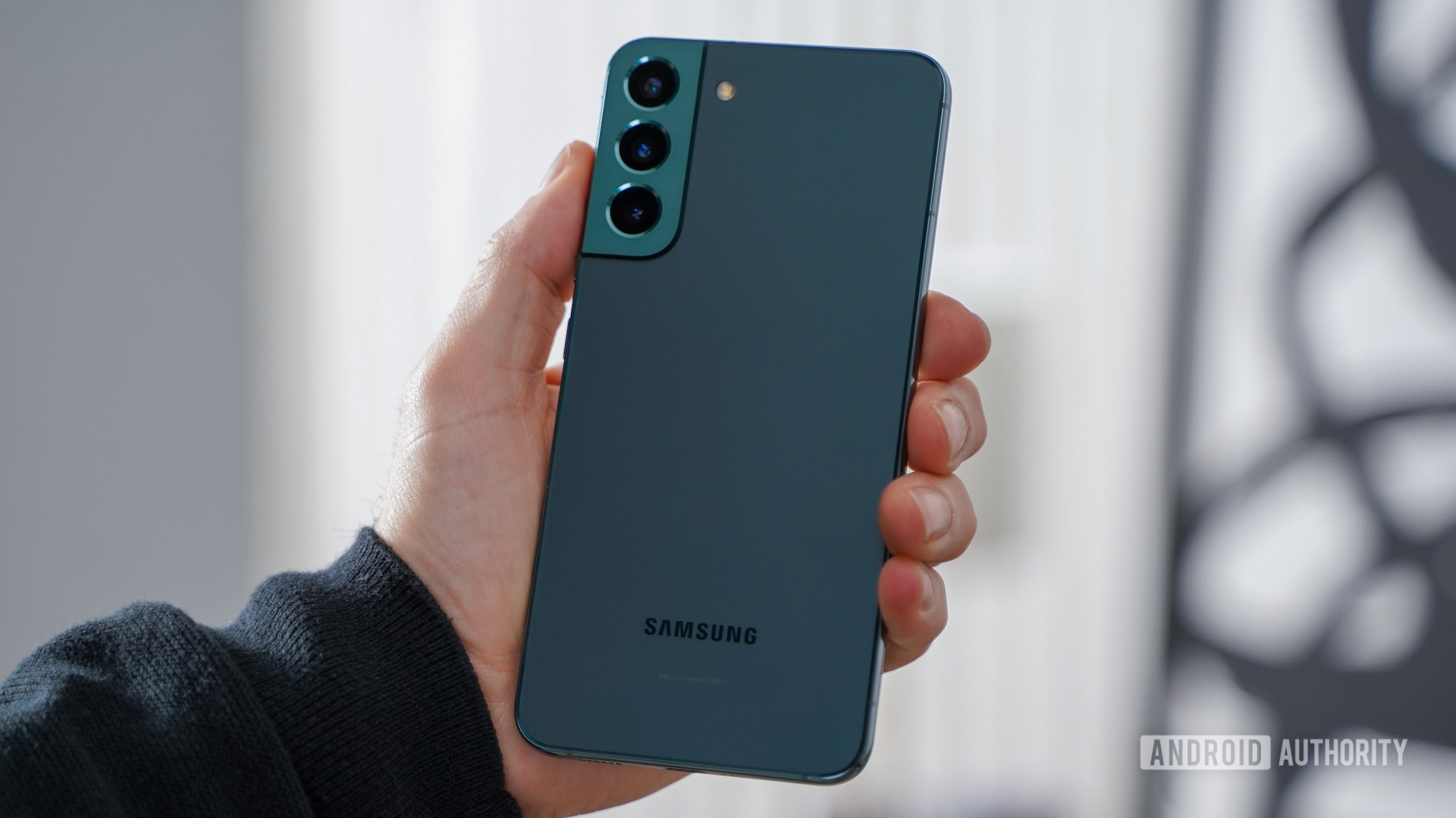 Samsung Galaxy S22 Plus angled in hand rear panel Samsung Galaxy S22 Plus angled in hand rear panel