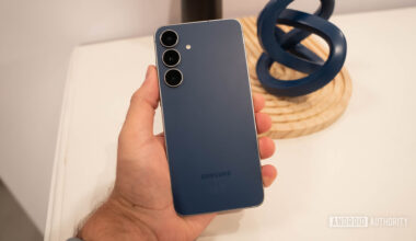 Samsung Galaxy S25 FE in Navy in man's hand showing back of phone