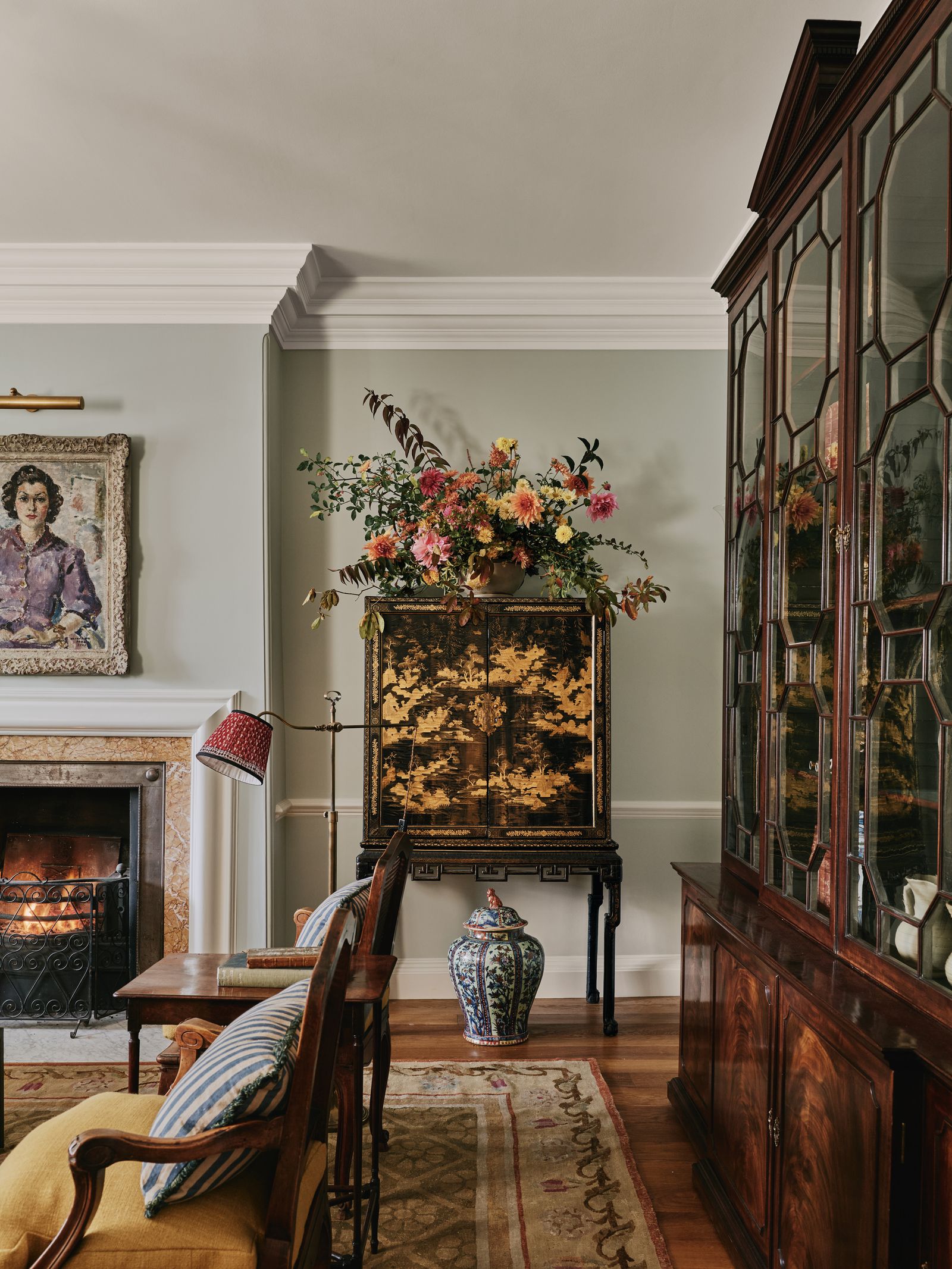 At the other end of the room pieces include an 18thcentury Chinese export black lacquer cabinet a mahogany breakfront...