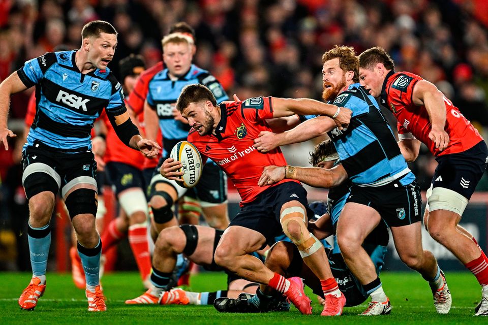Alex Nankivell of Munster is tackled by Rory Jennings of Cardiff Rugby during the United Rugby Championship match at Thomond Park in Limerick. Photo: Sam Barnes/Sportsfile