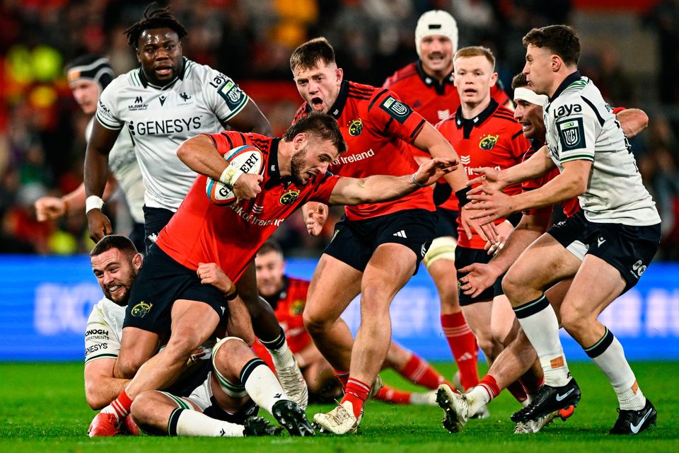 Alex Nankivell of Munster is tackled by Josh Murphy of Connacht during the United Rugby Championship match at Thomond Park in Limerick. Photo: Ben McShane/Sportsfile