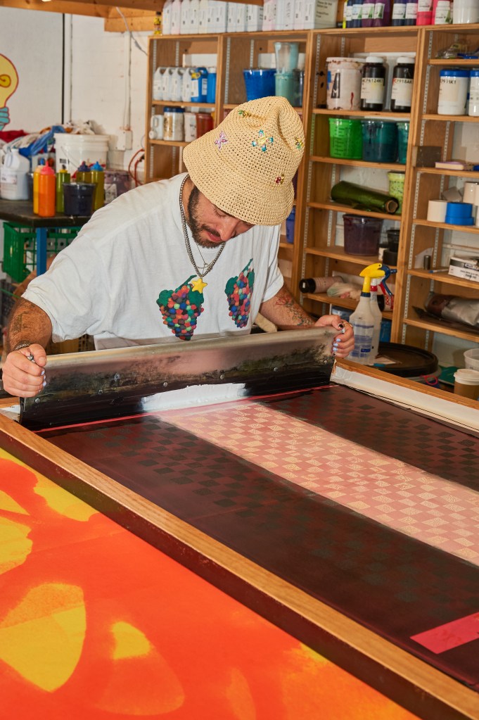 Daniel Bortz screenprinting fabric in his studio.