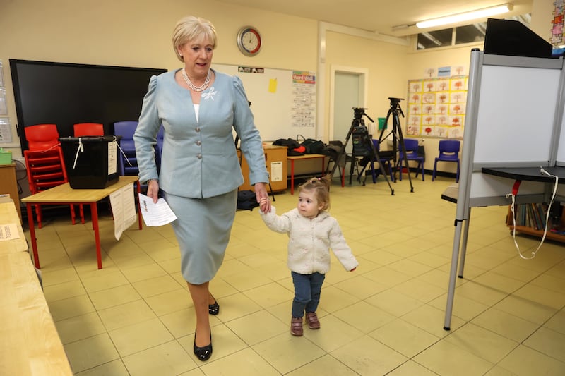 Fine Gael candidate Heather Humphreys casts her vote with the help of her one-year-old grandaughter Charlotte at Killeevan Central National School in Newbliss, Co Monaghan