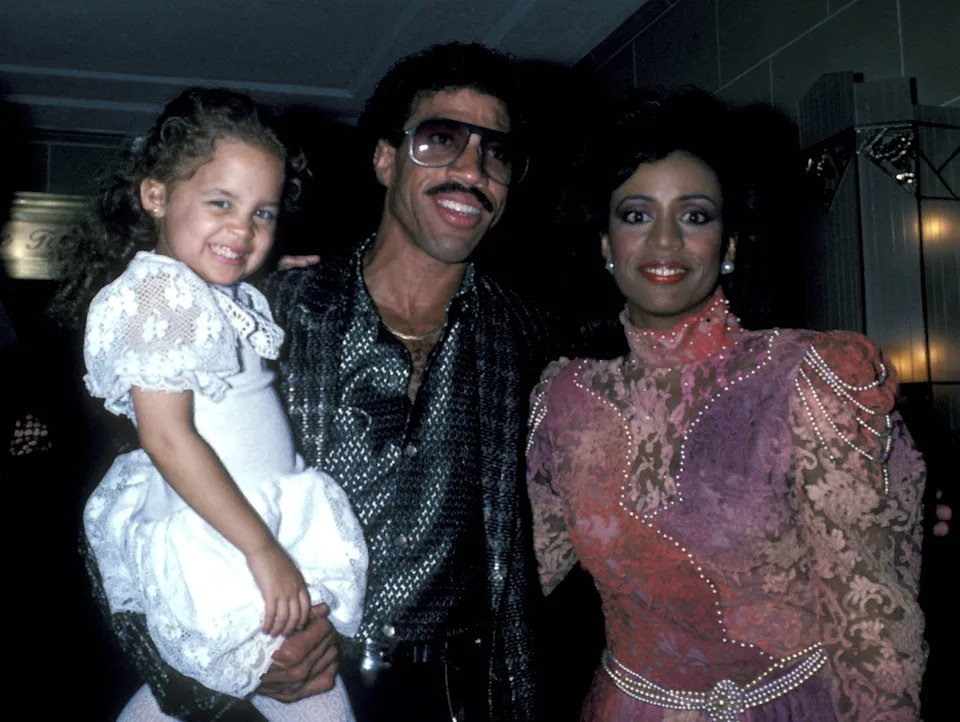 Lionel Richie and his ex-wife Brenda are pictured with their young daughter Nicole Richie in the 80s.