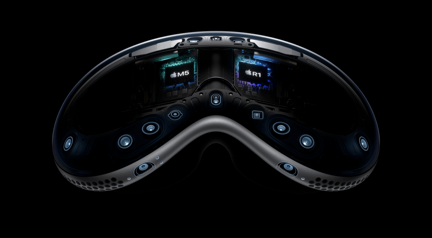Black virtual reality headset with two screens displaying 'M5' and 'R1.' Features multiple sensors and buttons on the front, set against a black background.