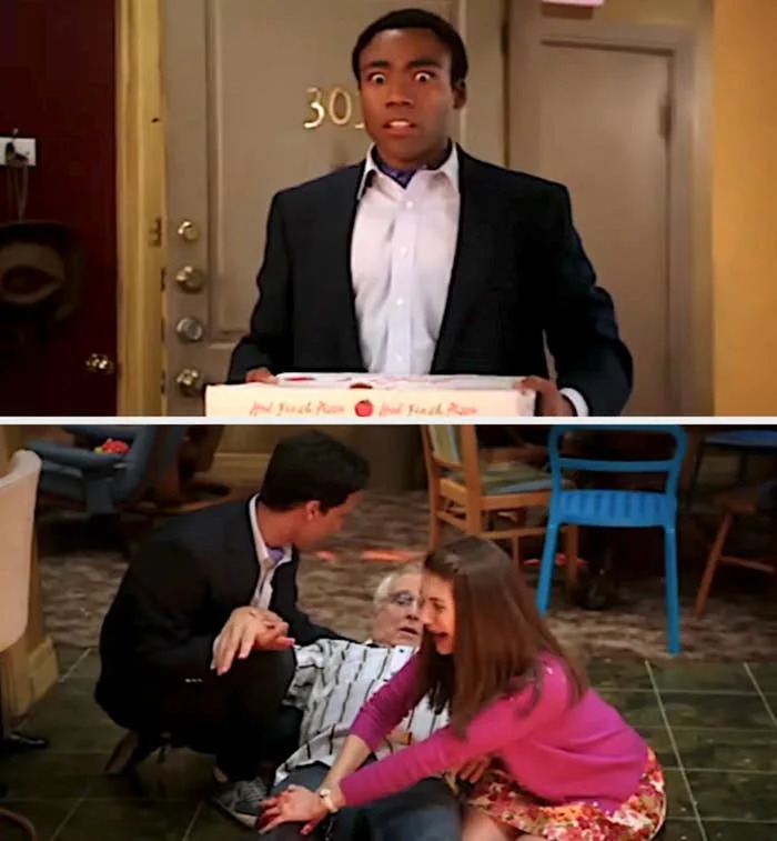 A surprised person holding a pizza box sees a room in chaos, with two people attending to someone on the floor. This is a scene from a TV comedy