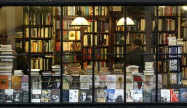 books and patrons through a bookstore window
