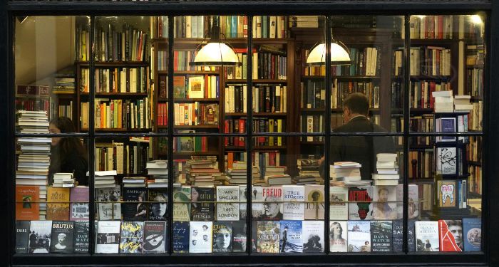 books and patrons through a bookstore window
