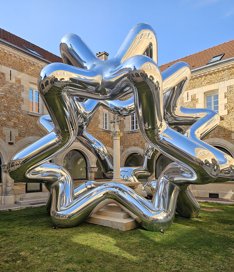 cyril lancelin's inflatable sculpture of star loops reflects the courtyard of étrépagny library