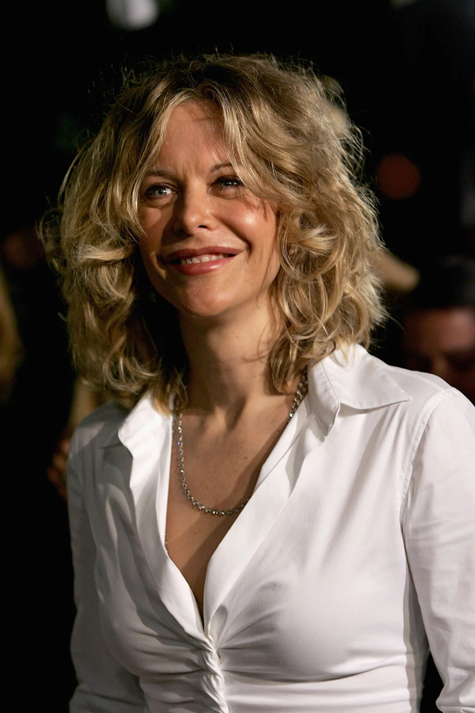 Meg Ryan smiling at a formal event
