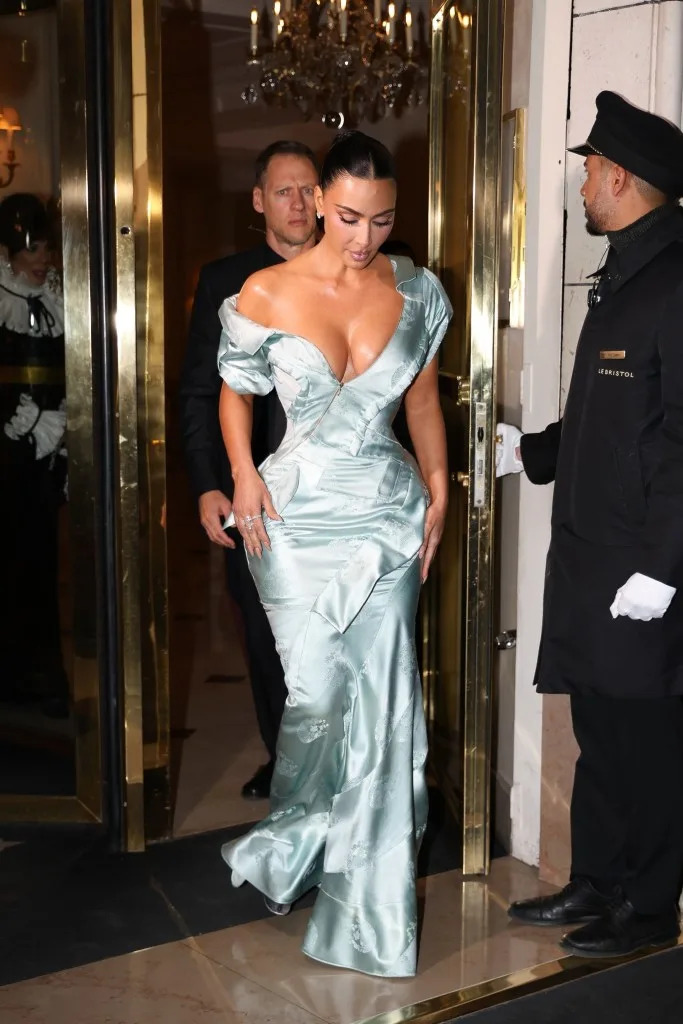 The mint-colored, asymmetrical dress was crafted from embossed silk and featured roll-tab sleeves with a pointy collar. Aissaoui Nacer / BACKGRID