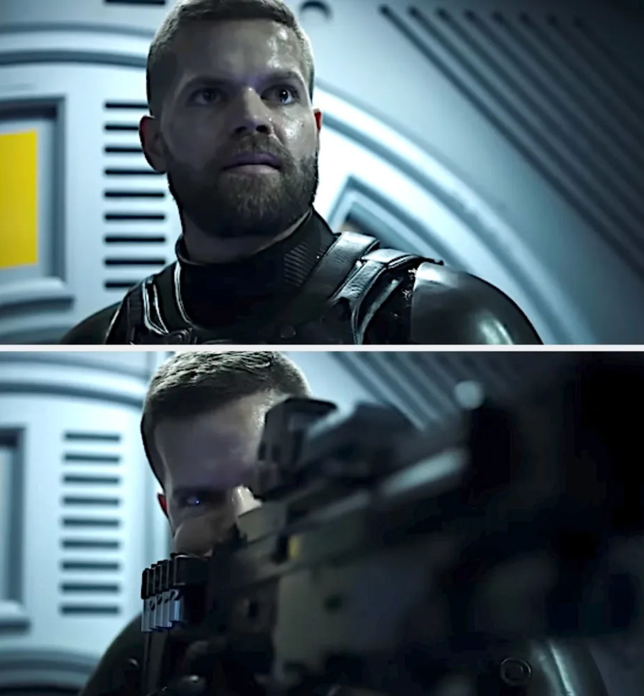 Actor in sci-fi military gear aims a rifle, set in a futuristic environment