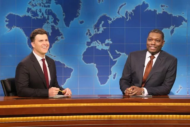 Will Heath/NBC via Getty  'SNL Weekend Update' anchors Colin Jost and Michael Che on April 5, 2025